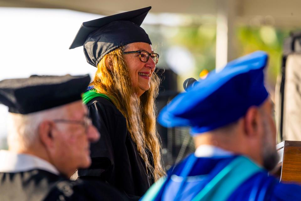 Dr. Heidi Harley, a New College of Florida faculty member, spoke during the college's May 17, 2024, graduation ceremony on the grounds of College Hall.