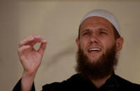 FILE PHOTO: Islamist preacher Sven Lau delivers a speech during a pro-Islam demonstration in Cologne, Germany June 9, 2012. REUTERS/Ina Fassbender/File Photo