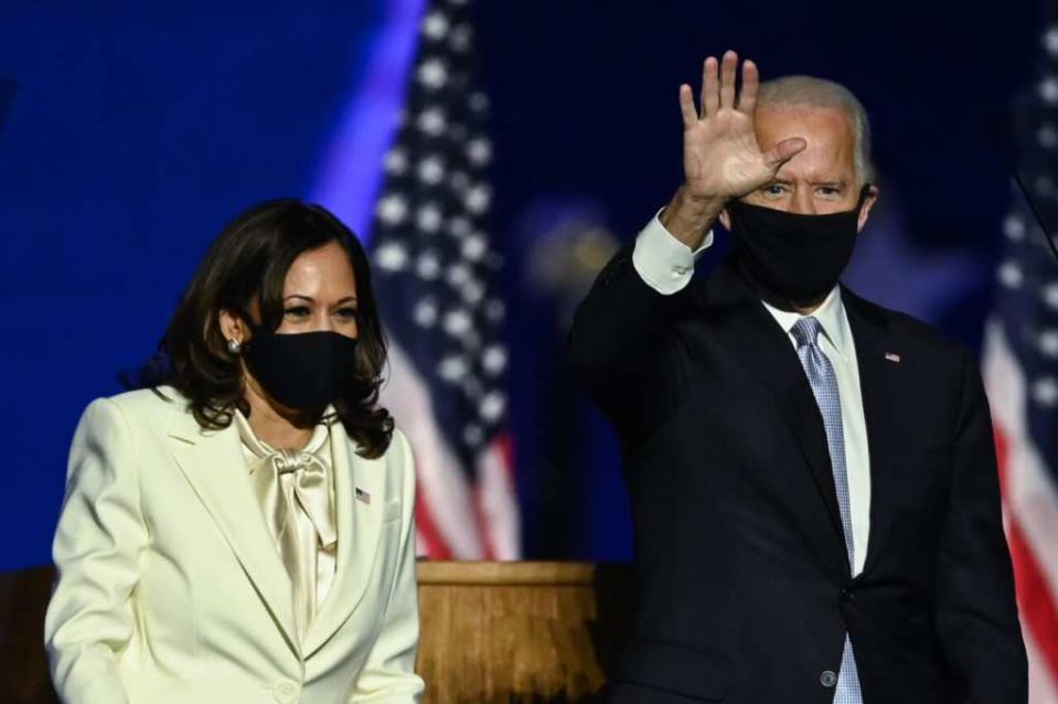 U.S. President-elect Joe Biden arrives next to Vice President-elect Kamala Harris to deliver remarks in Wilmington, Delaware, on Nov. 7, 2020, after being declared the winners of the presidential election. (Photo by JIM WATSON/AFP via Getty Images)