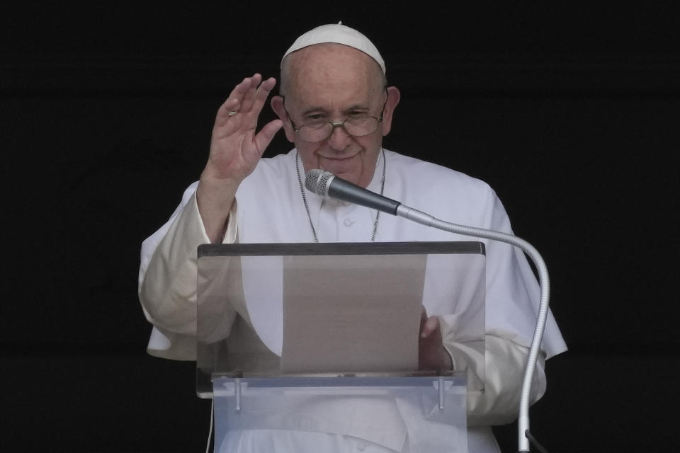 Pope Francis delivers his blessing as he recites the Angelus noon prayer from the window of his studio overlooking St.Peter's Square, at the Vatican, Sunday, Sept. 11, 2022. (AP Photo/Andrew Medichini)