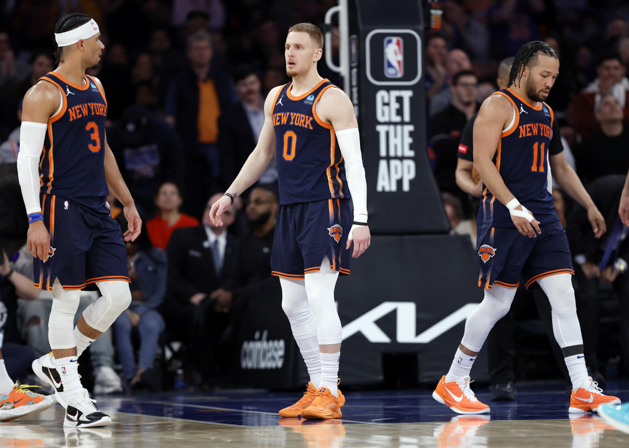 NEW YORK, NEW YORK - APRIL 04: Josh Hart #3, Donte DiVincenzo #0 and Jalen Brunson #11 of the New York Knicks look on during the second half against the Sacramento Kings at Madison Square Garden on April 04, 2024 in New York City. The Knicks won 120-109. NOTE TO USER: User expressly acknowledges and agrees that, by downloading and/or using this Photograph, user is consenting to the terms and conditions of the Getty Images License Agreement. (Photo by Sarah Stier/Getty Images)