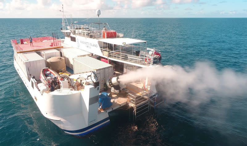 Plume from sprayer jets on a vessel is seen during the second field trial at Broadhurst Reef on the Great Barrier Reef