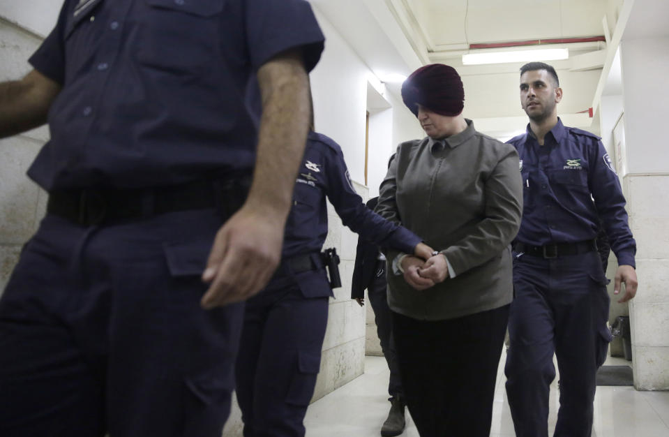 FILE - Australian Malka Leifer is brought to a courtroom in Jerusalem, Feb. 27, 2018. Leifer, a former principal of a Jewish girls school, was found guilty Monday, April 3, 2023, of sexually abusing two students. (AP Photo/Mahmoud Illean, FILE)