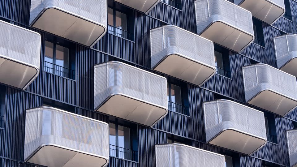 Balconies on a block of athletes' accommodation in the Olympic Village in Saint-Denis. The Olympic Village, north of Paris, will be an eco-quarter where all buildings under eight floors will be made from wood and glass, and all energy will be sustainably sourced via heat pumps and renewables. - Nathan Laine/Bloomberg/Getty Images