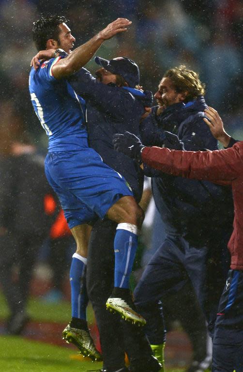 Italy's Eder celebrates after scoring with head coach Antonio Conte during the EURO 2016 Group H football match with Bulgaria in Sofia, Bulgaria on March 28, 2015