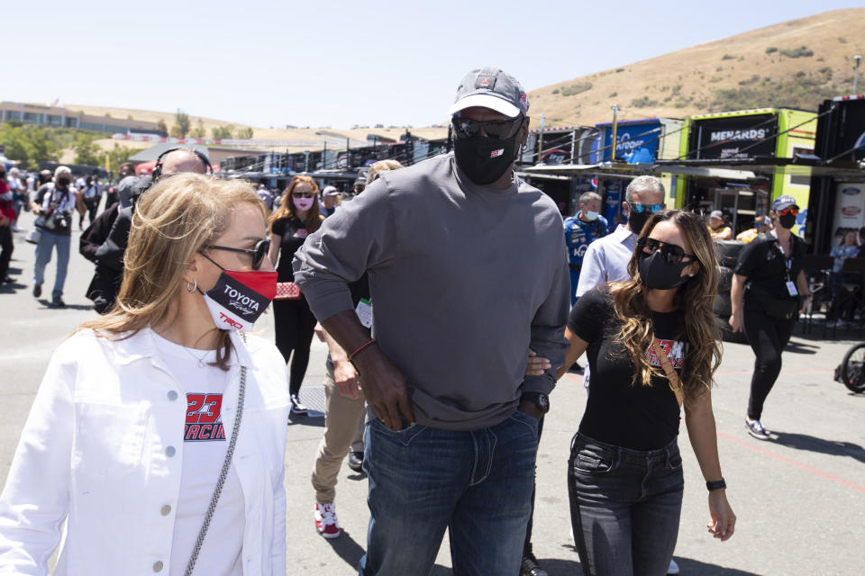 Former NBA basketball player Michael Jordan, center, visits racing teams before a NASCAR Cup Series race, Sunday, June 6, 2021, at Sonoma Raceway in Sonoma, Calif. (AP Photo/D. Ross Cameron)