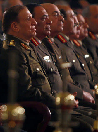 FILE PHOTO: General Sami Anan (L), Army chief of Staff and member of the SCAF at the Supreme Council of the Armed Forces, and other high-ranking military officials attend the Coptic Christmas Eve mass at the main cathedral in Cairo, Egypt January 6, 2012. REUTERS/Amr Abdallah Dalsh/File Photo