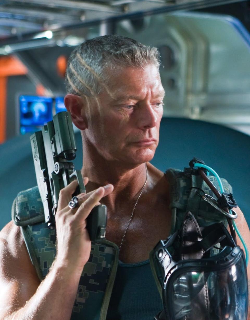 <p>Stephen Lang plays the bad guy in James Cameron’s 2009 space war film with relish. He’s a man who looks, talks, and carries himself like he always has a cigar in his mouth. Quaritch takes actual joy in destroying the resources of Pandora, and nobody on any planet can rival him when it comes to operating gigantic robot gunners.</p>