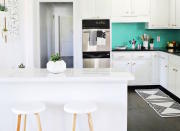 <body> <p>In this <a rel="nofollow noopener" href=" http://www.bobvila.com/slideshow/10-total-kitchen-makeovers-and-what-they-cost-49476?bv=yahoo" target="_blank" data-ylk="slk:happy kitchen;elm:context_link;itc:0;sec:content-canvas" class="link ">happy kitchen</a>, immaculate white cabinets get a huge infusion of energy from the bright blue backsplash, which is actually a coat of paint brushed over dated brown tiles. For a hit of style, the homeowner opted for brass drawer pulls and geometric succulent planters.</p> <p><strong>Related: <a rel="nofollow noopener" href=" http://www.bobvila.com/slideshow/if-this-then-that-your-guide-to-pairing-paint-colors-49511?#.Vz3u5JPyuRs?bv=yahoo" target="_blank" data-ylk="slk:If This, Then That: Your Guide to Pairing Paint Colors;elm:context_link;itc:0;sec:content-canvas" class="link ">If This, Then That: Your Guide to Pairing Paint Colors</a> </strong> </p> </body>