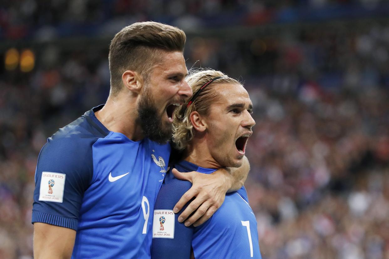 Antoine Griezmann celebrates his first-half goal with Olivier Giroud. (Getty)