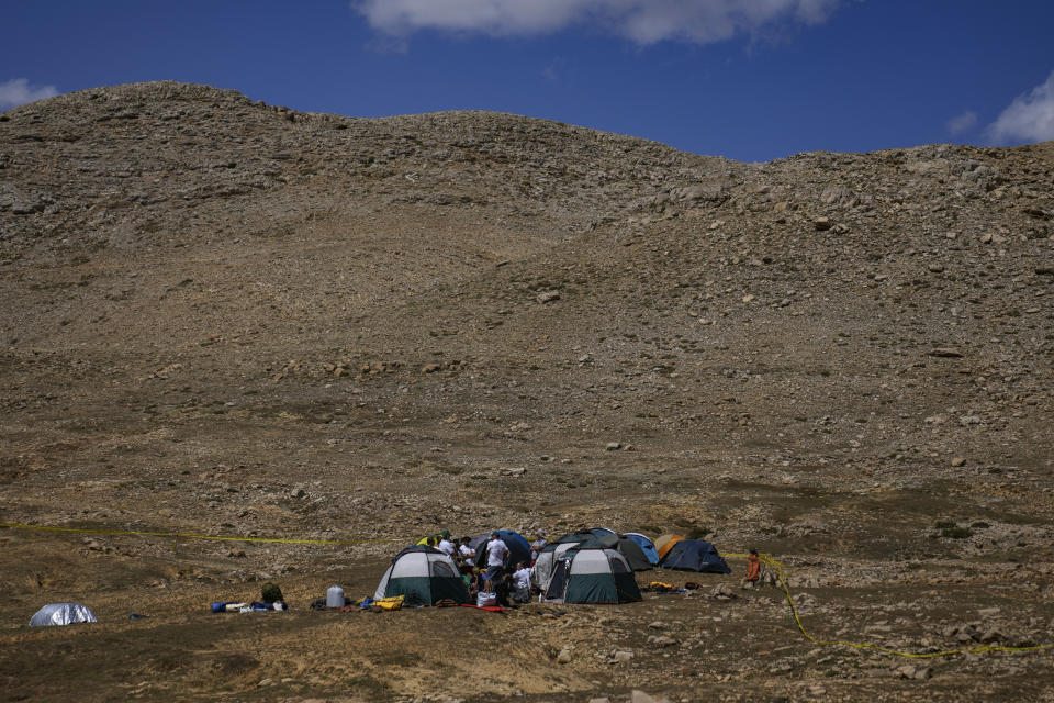European Cave Rescue Association (ECRA) members, camp next to the Morca cave during a rescue operation near Anamur, south Turkey, Friday, Sept. 8, 2023. American researcher Mark Dickey, 40, who fell ill almost 1,000 meters (more than 3,000 feet) below the entrance of a cave in Turkey, has recovered sufficiently enough to be extracted in an operation that could last three or four days, a Turkish official was quoted as saying on Friday. (AP Photo/Khalil Hamra)