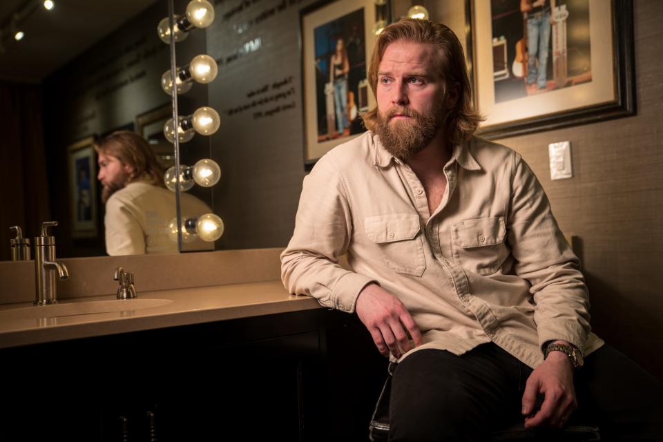 Charles Wesley Godwin sits in his dressing room before his debut at the Grand Ole Opry in Nashville on Feb. 10.