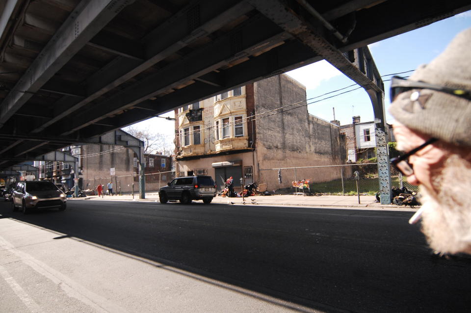 Homeless Philadelphians are seen under an overpass.