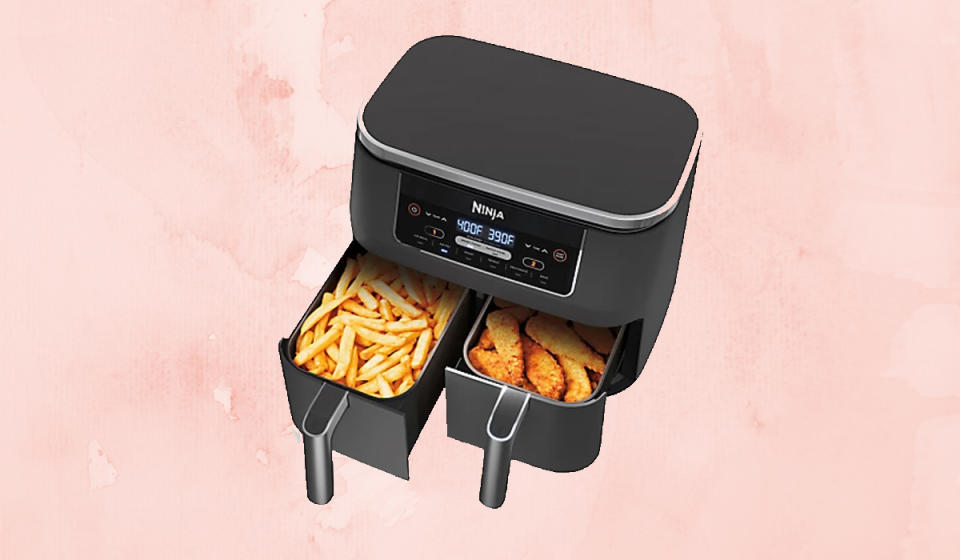 Black Ninja dual-basket air fryer, showing fries on one side and chicken tenders on the other