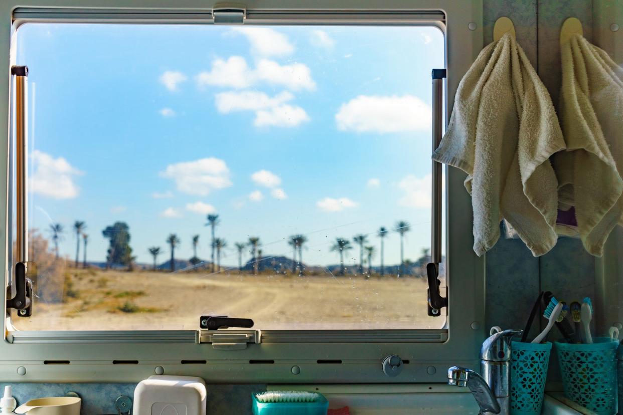 View from caravan bathroom inside on nature landscape in Sierra Alhamilla mountain range, Spain. Adventure with motor home.