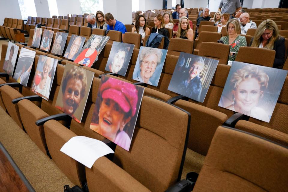 Portraits of the victims of Billy Chemirmir are displayed on chairs ahead of victim impact statements in Chemirmir’s trial in October (© 2022 Shafkat Anowar // The Dallas Morning News)