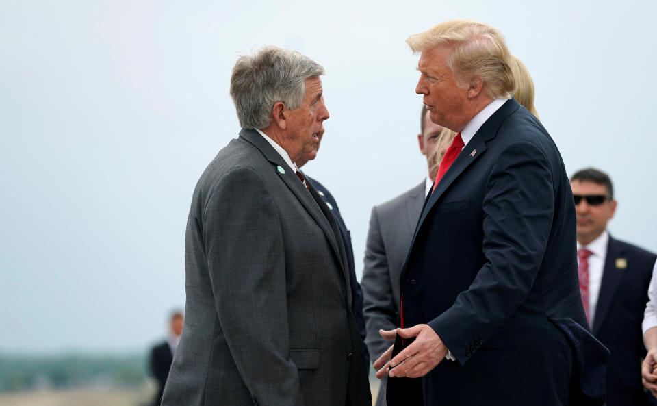 President Donald Trump speaks with Missouri Gov. Mike Parson (R) at a stop in St. Louis on July 26, 2018. (Photo: Joshua Roberts / Reuters)