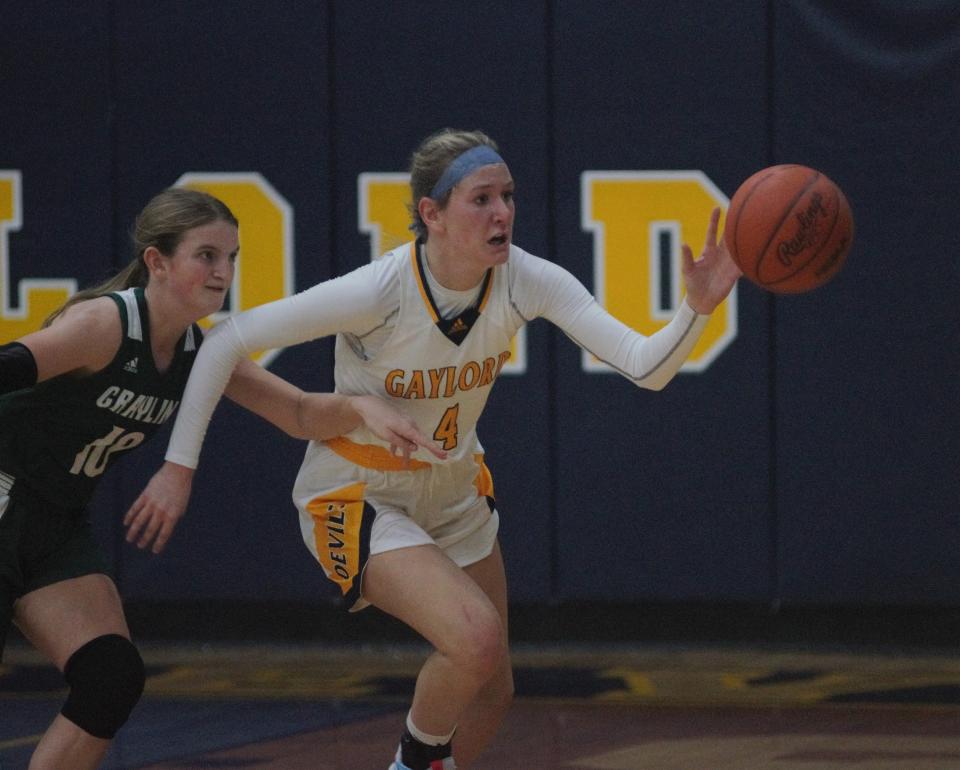 Meghan Keen tracks down a loose ball during a girls basketball matchup between Gaylord and Grayling on Tuesday, November 29.