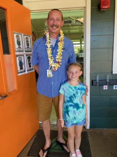 Robert Livermore stands with his daughter outside of his King Kamehameha III classroom with his daughter days before a fire destroyed the school. (Courtesy of Robert Livermore)
