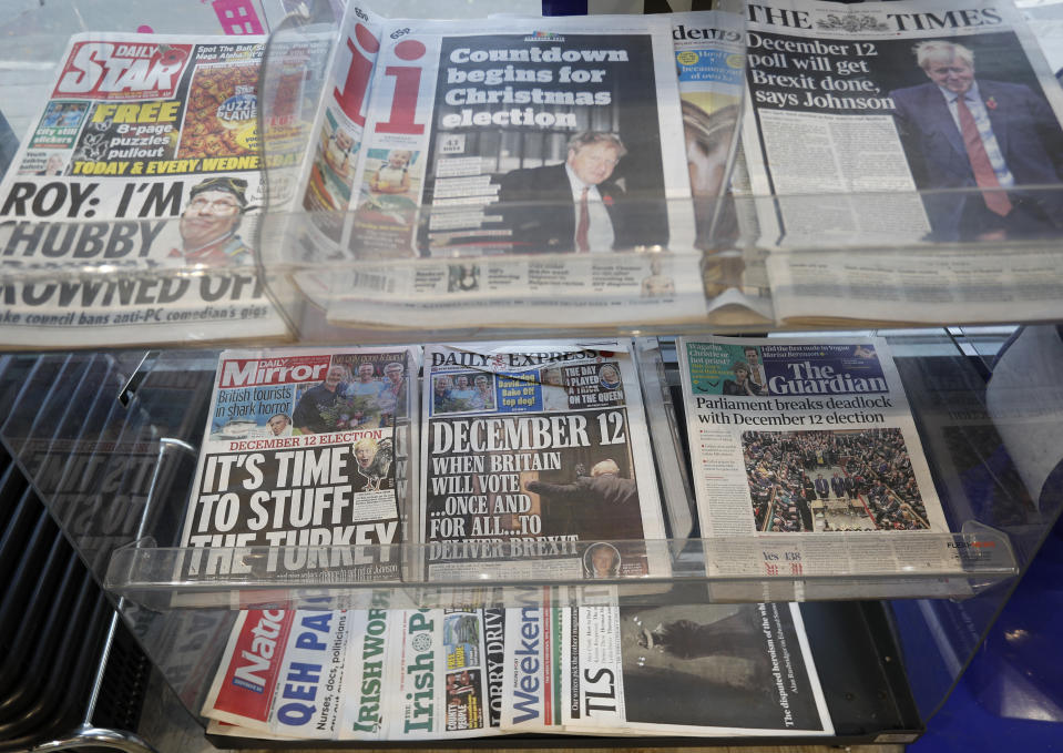 Newspaper front pages referring to the upcoming general election are displayed at a newsagent in London, Wednesday, Oct. 30, 2019. The House of Commons on Tuesday approved the Dec. 12 election in hopes of breaking the deadlock over Britain's departure from the European Union. While Johnson's Conservative Party has a wide lead in opinion polls, analysts say the election is unpredictable because Brexit cuts across traditional party loyalties. (AP Photo/Frank Augstein)