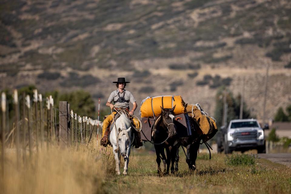 Jake Harvath rides down the side of a road in Charleston as he sets out on the first morning of a yearlong horse ride across the country on Monday, Sept. 25, 2023. | Spenser Heaps, Deseret News