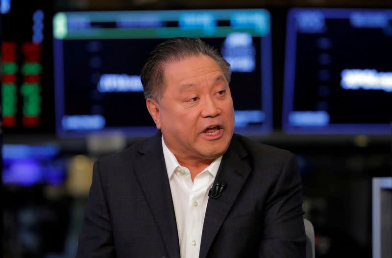 FILE PHOTO: Hock Tan, CEO of Broadcom, speaks on the floor of the New York Stock Exchange shortly before the opening bell in New York