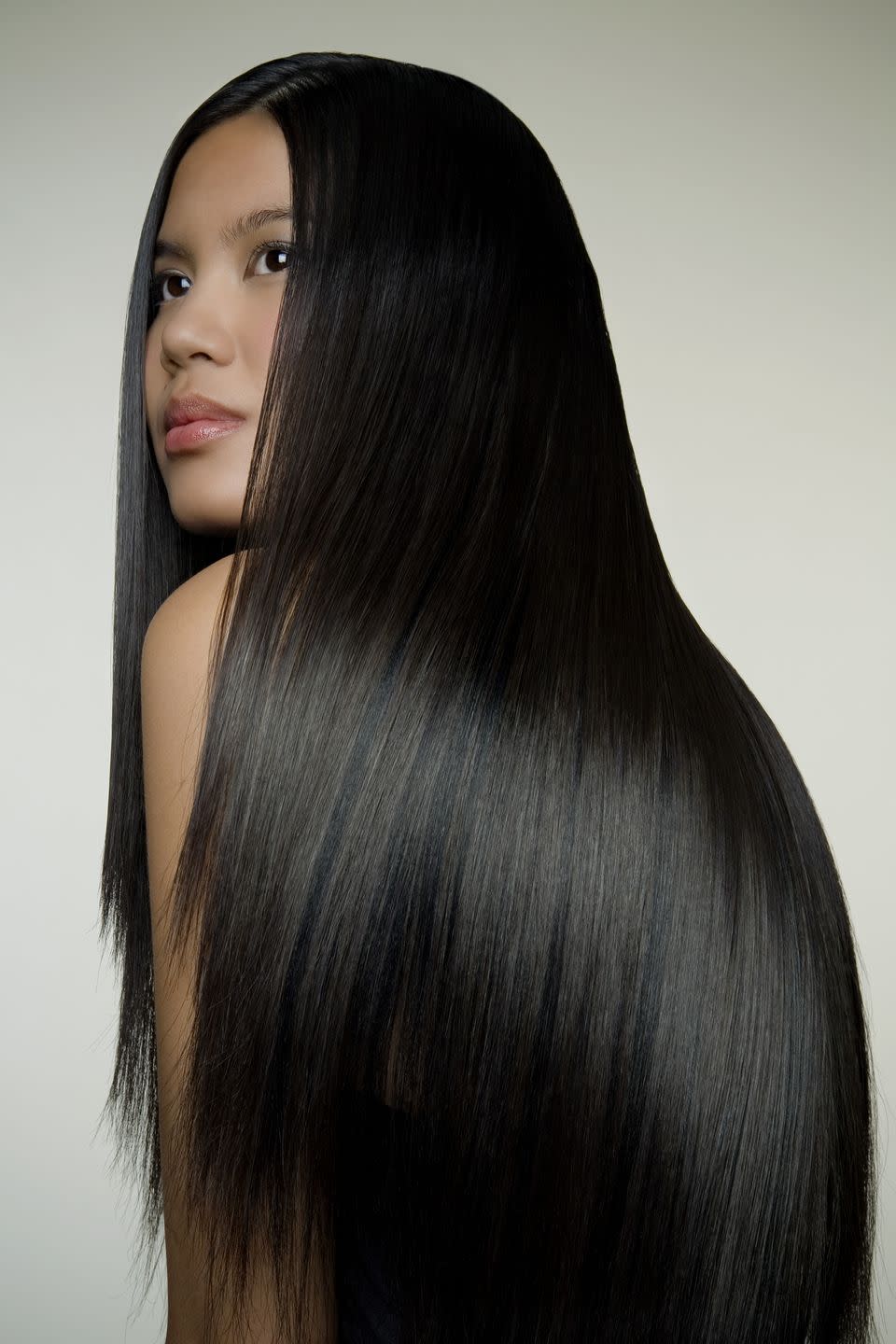 woman with long shiny hair, profile