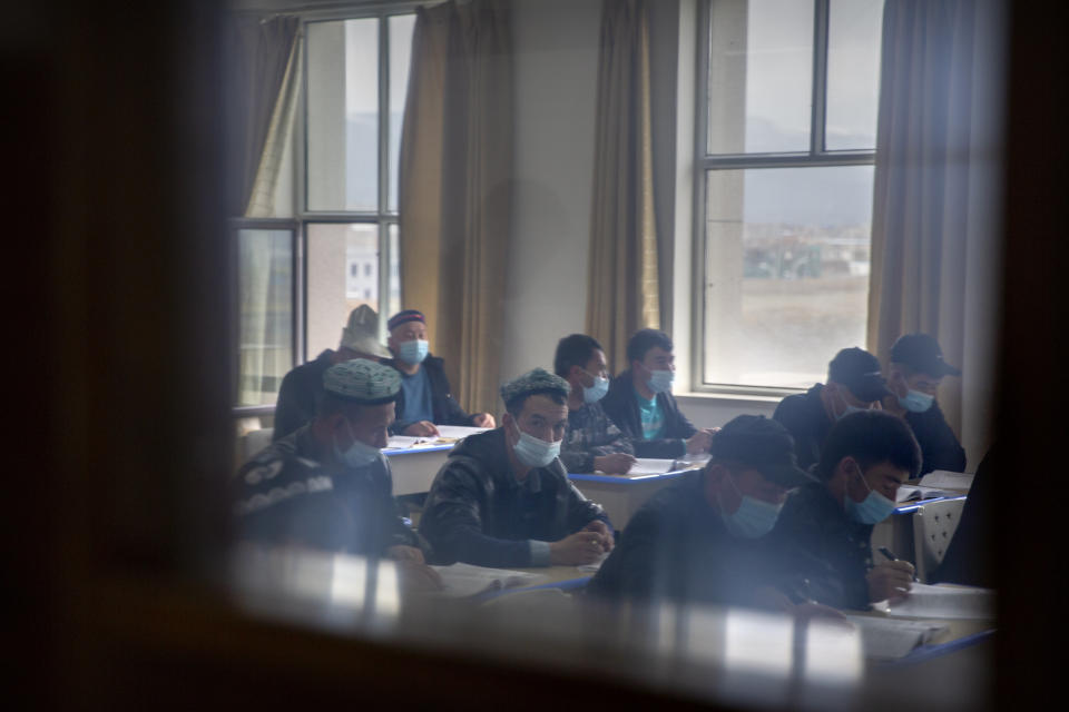 Uyghurs and other students attend a class at the Xinjiang Islamic Institute, as seen during a government organized visit for foreign journalists, in Urumqi in western China's Xinjiang Uyghur Autonomous Region on April 22, 2021. Under the weight of official policies, the future of Islam appears precarious in Xinjiang, a remote region facing Central Asia in China's northwest corner. Outside observers say scores of mosques have been demolished, which Beijing denies, and locals say the number of worshippers is on the decline. (AP Photo/Mark Schiefelbein)