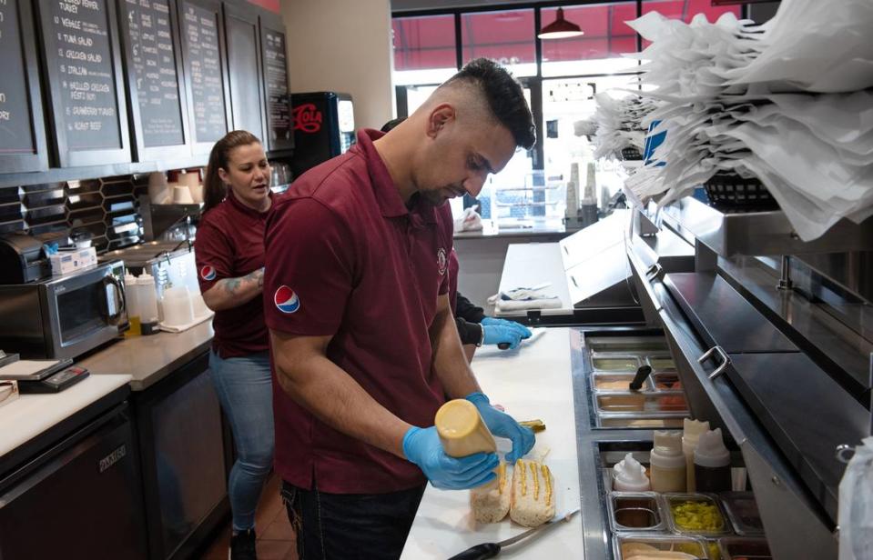 Inder Singh prepares a sandwich at West Coast Sourdough in the Monte Vista Crossings shopping center in Turlock, Calif., Friday, March 17, 2023.