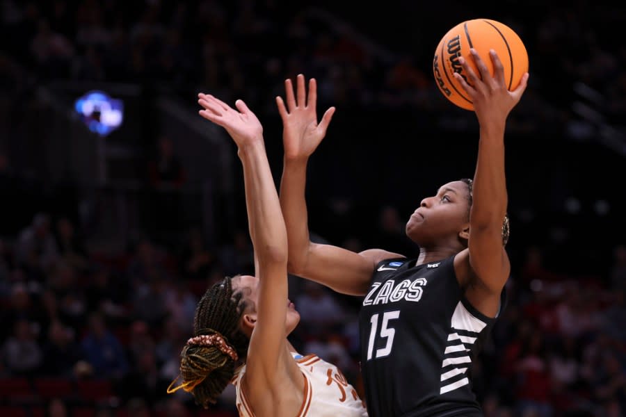 Gonzaga forward Yvonne Ejim (15) shoots over a Texas player during the first half of a Sweet 16 college basketball game in the women’s NCAA Tournament, Friday, March 29, 2024, in Portland, Ore. (AP Photo/Howard Lao)