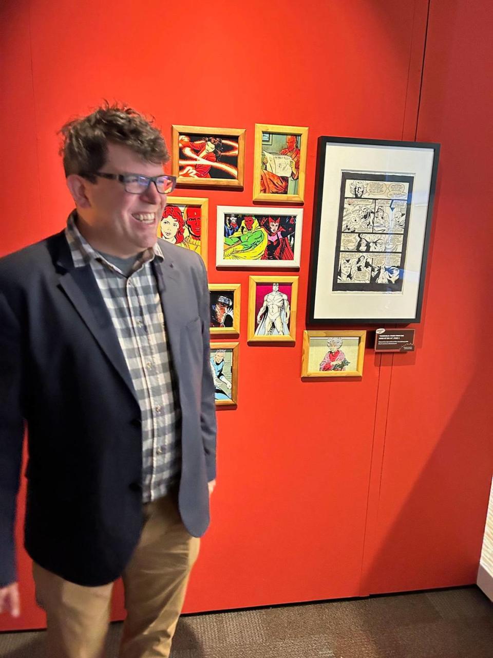 Patrick A. Reed, co-curator of the Marvel exhibit, with original art of his from a Scarlet Witch storyline that ultimately was used in the Dinsey+ series “Wandavision.”