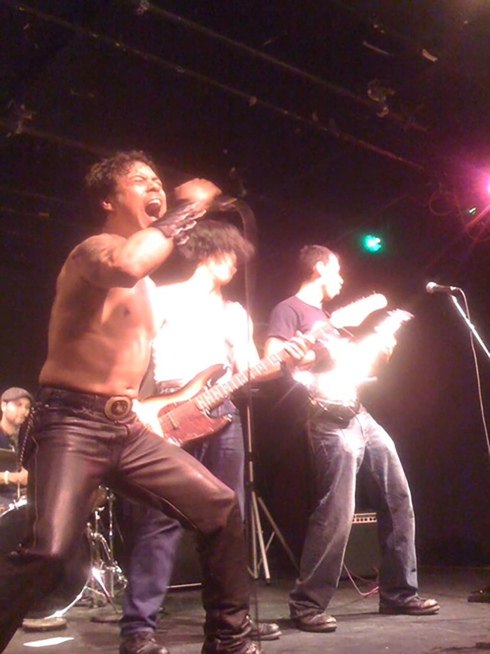 <div class="inline-image__caption"><p>David Anzuelo singing with his band, MonsterRally circa 2007. To his right on bass is actor Raul Castillo. </p></div> <div class="inline-image__credit">Courtesy of David Anzuelo</div>
