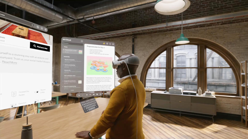 A 3D render of a man working with Apple Vision Pro