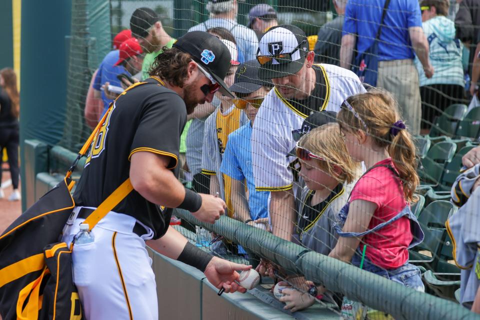 Pittsburgh Pirates left fielder Ryan Vilade signs autographs before a spring training game at LECOM Park, Feb. 27, 2023 in Bradenton, Fla.