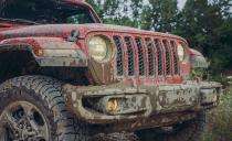 <p>We're not sorry for these dirty pictures. The Gladiator proportions may look slightly awkward for a Wrangler, thanks to its pickup-box-friendly rear-axle location, but covering it in mud helps, as does the Rubicon regalia.</p>