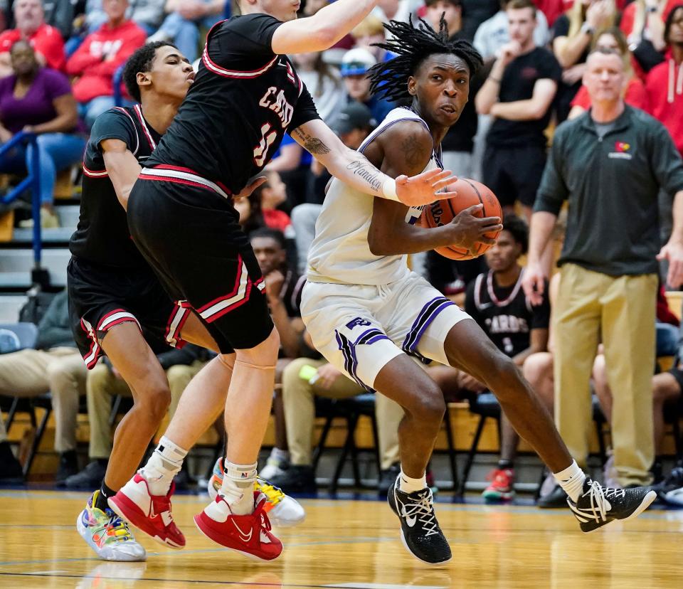 Ben Davis' Sheridan Sharp (with ball) rushes up the court against Southport 's Shane Handlon on Wednesday, March 1, 2023 at Perry Meridian High School in Indianapolis.