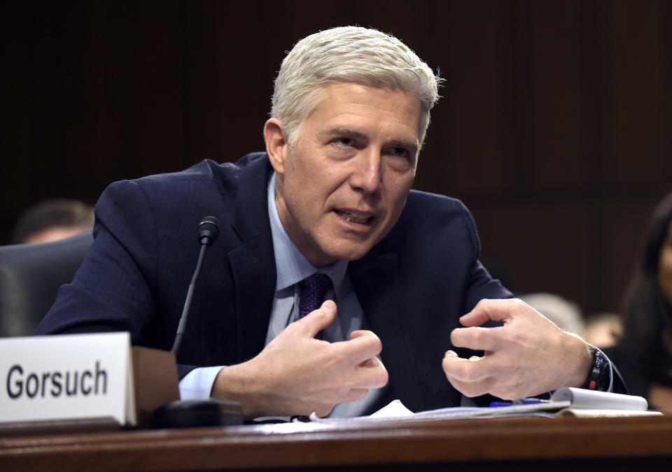 FILE - In this March 21, 2017, file photo, Supreme Court Justice nominee Judge Neil Gorsuch explains mutton busting, an event held at rodeos similar to bull riding or bronc riding, in which children ride or race sheep, as he testifies on Capitol Hill in Washington during his confirmation hearing before the Senate Judiciary Committee. The Senate Judiciary Committee is expected to vote on Gorsuch's nomination on April 3. (AP Photo/Susan Walsh, File)