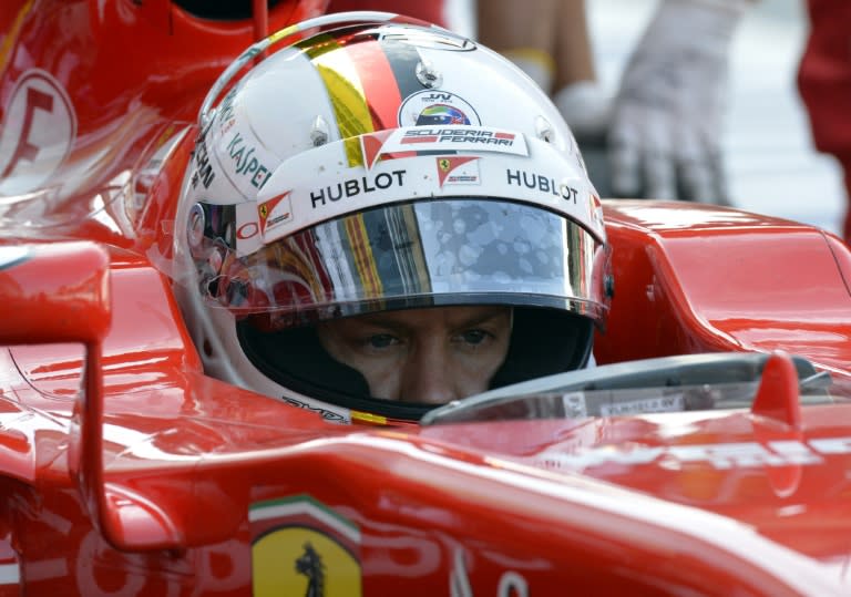 Ferrari's German driver Sebastian Vettel sits in his car during the first practice session at the Autodromo Nazionale circuit in Monza on September 4, 2015, ahead of the Italian Formula One Grand Prix