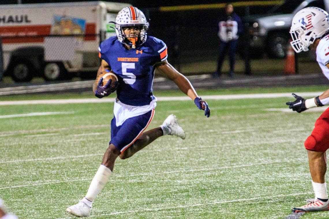 Northside’s Duke McClinton (5) gets free outside and gains yardage during the Eagles’ game against Veterans Friday night.