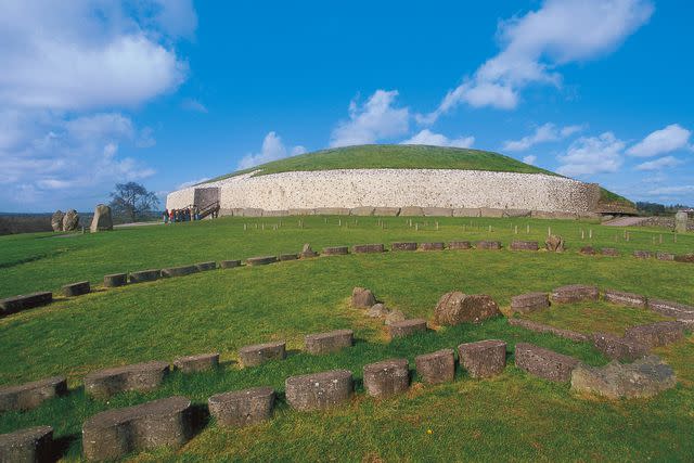 <p>DeAgostini/Getty</p> The Newgrange monument in Ireland