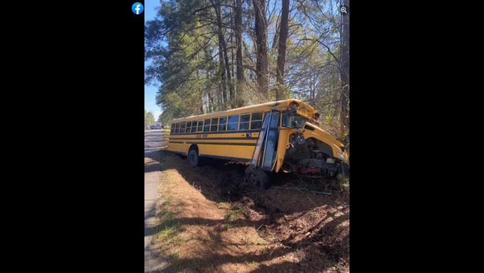 The bus was pushed into a ditch after a nearly head-on collision, deputies said.