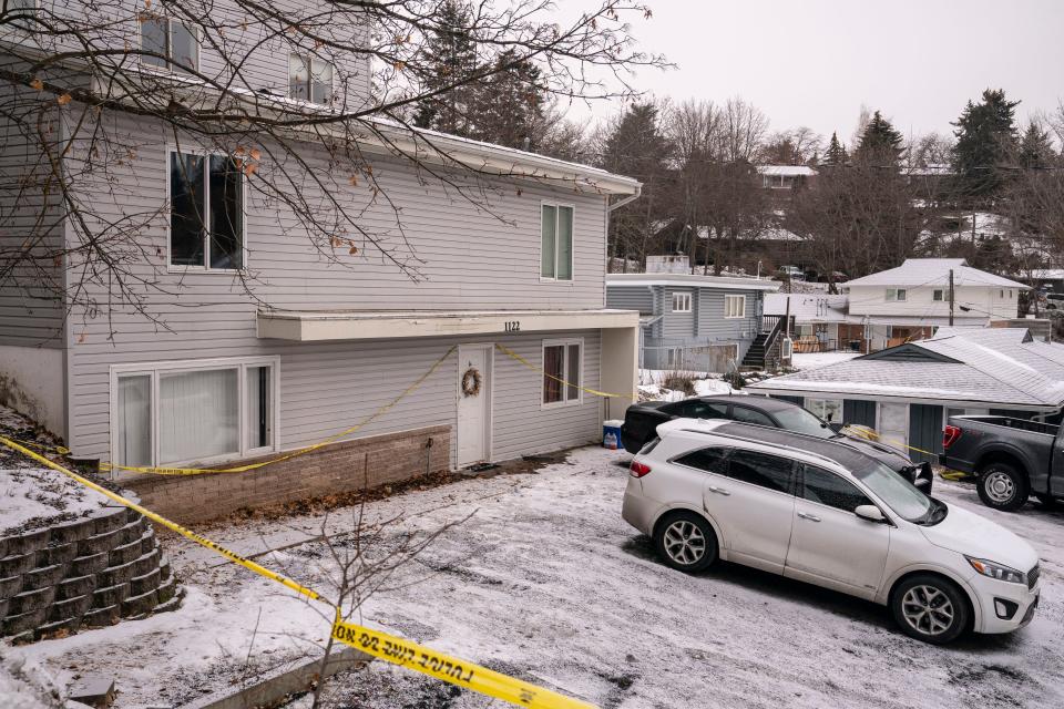 Police tape surrounds the Moscow, Idaho home that is the site of the November 13 killings of four University of Idaho students.
