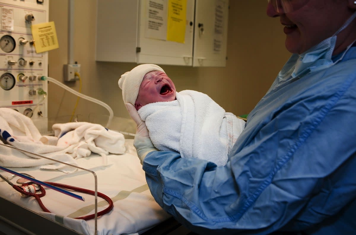 File: In this file photograph dated 6 March 2007, a young boy is weighed after being born in an NHS maternity unit, in Manchester, England (Getty Images)