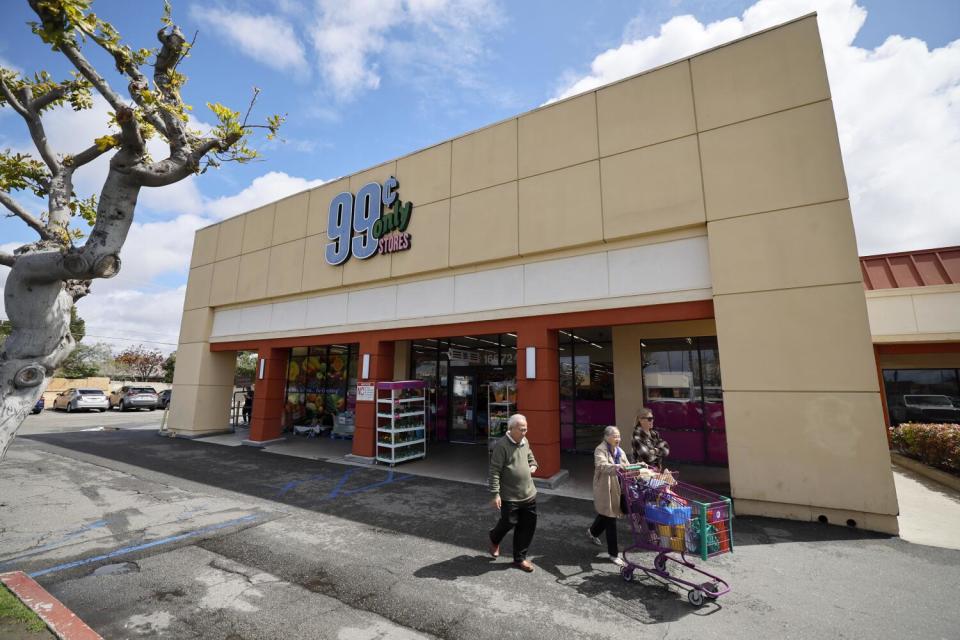 Shoppers exit the 99 Cents Only store in Huntington Beach.