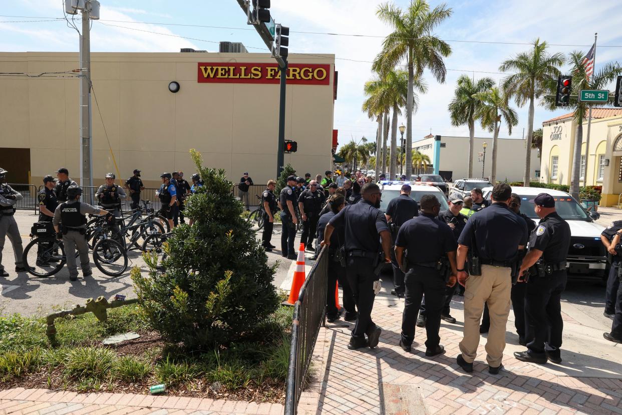 Fort Pierce Police Department officers gather outside the Alto Lee Adams, Sr. United States Courthouse following former President Donald Trump's classified documents court hearing Thursday, March 14, 2024.
