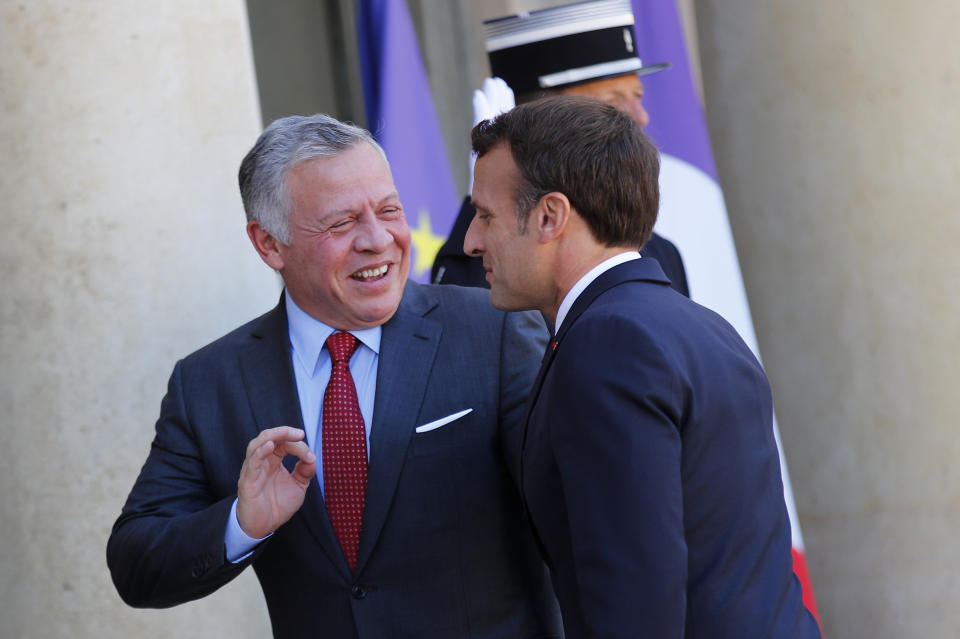 King Abdullah II of Jordan, left, speaks with French President Emmanuel Macron as he arrives at the Elysee Palace, in Paris, Wednesday, May 15, 2019. Several world leaders and tech bosses are meeting in Paris to find ways to stop acts of violent extremism from being shown online. (AP Photo/Francois Mori)
