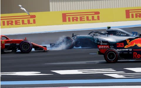 Bottas and Vettel collide - Credit: AP