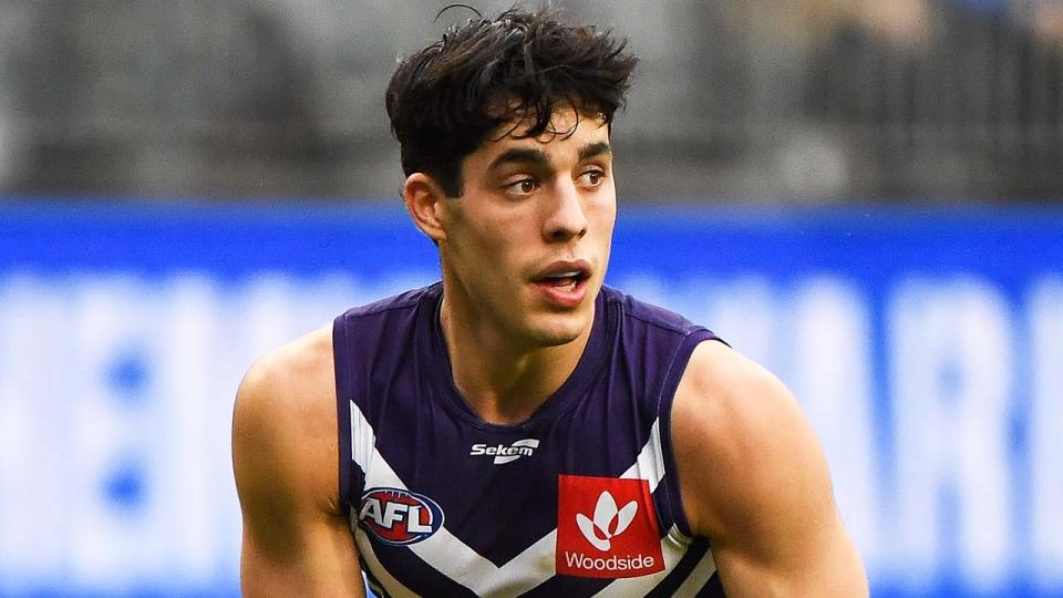 Fremantle star Adam Cerra (pictured) running the ball.