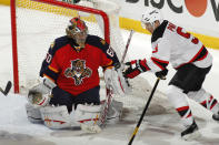 SUNRISE, FL - APRIL 21: Goaltender Jose Theodore #60 of the Florida Panthers defends the net as Zach Parise #9 of the New Jersey Devils hits the puck with his hand in front of the net in Game Five of the Eastern Conference Quarterfinals during the 2012 NHL Stanley Cup Playoffs at the BankAtlantic Center on April 21, 2012 in Sunrise, Florida. The Panthers defeated the Devils 3-0. (Photo by Joel Auerbach/Getty Images)