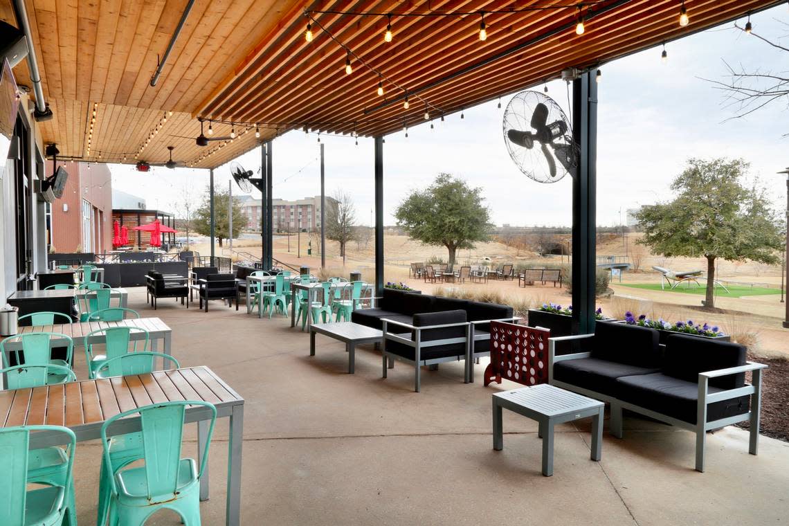 Hopdoddy Burger Bar has a sprawling patio overlooking bluestem prairie at Alliance Town Center.